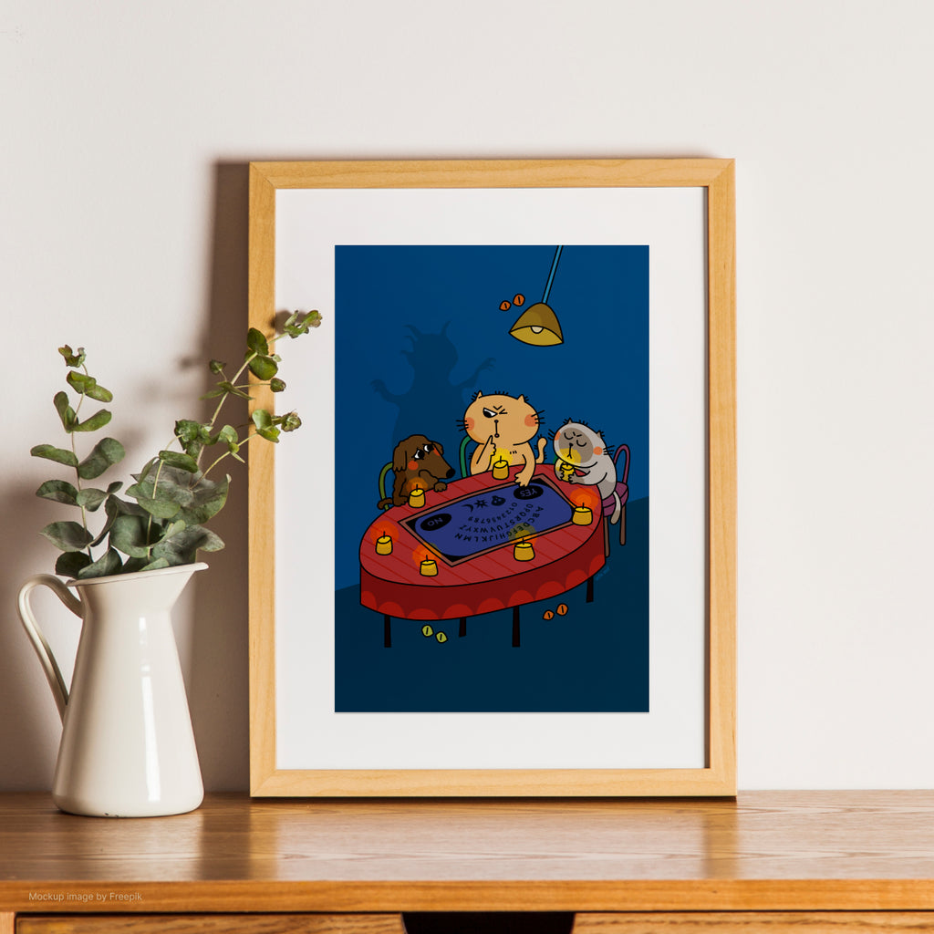 Framed artwork of a cartoon scene with characters around a table on a wooden shelf.