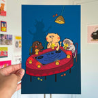 Cartoon cats playing with Ouija Board on a table with a hand holding the poster.