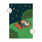 Illustration of two characters lying on a blanket under a starry sky with trees around.