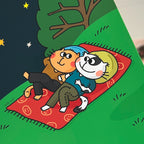 Cartoon cat characters sitting on a red blanket under a tree with stars in the background