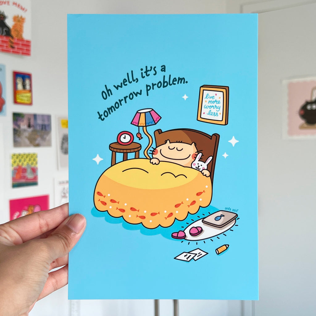 Illustration of a cat in bed with a blue background, held by a hand.