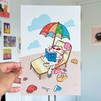 Cartoon cat on a beach chair with an umbrella, holding a book, with a hand holding the card.