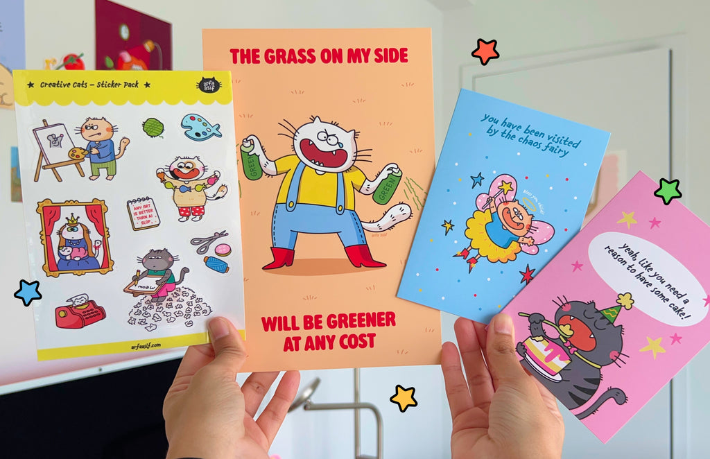 Four colorful paper goods held by a person against a white wall.