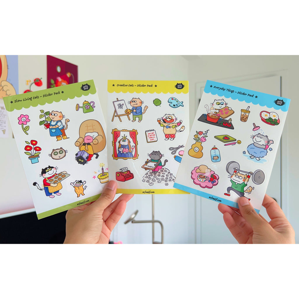 Three cat-themed sticker packs held by hands with a white background