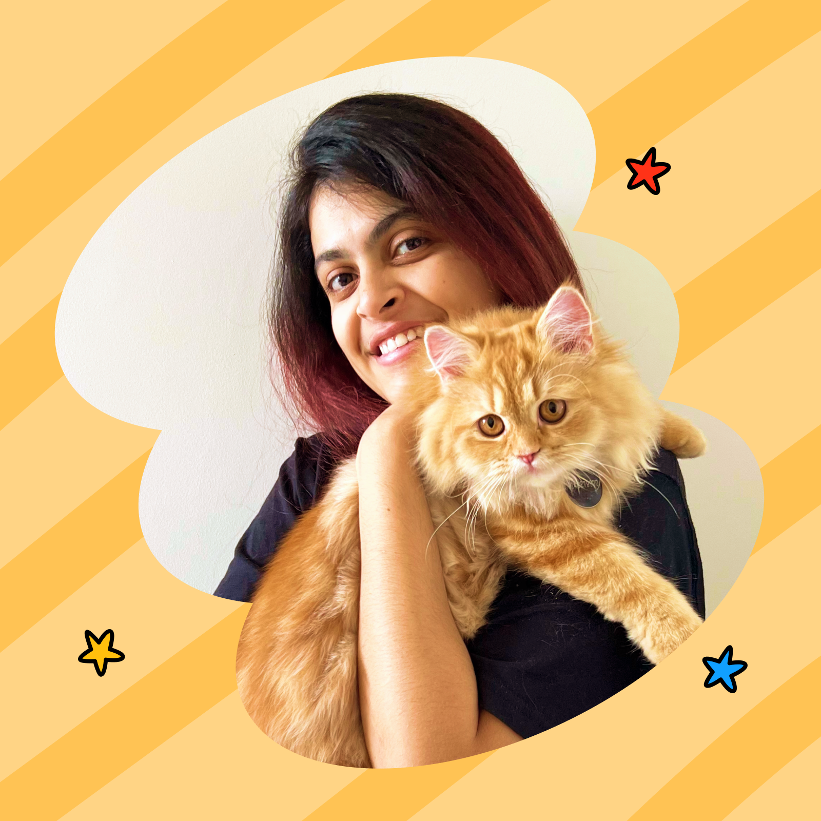 Woman holding a cat with a yellow and orange striped background